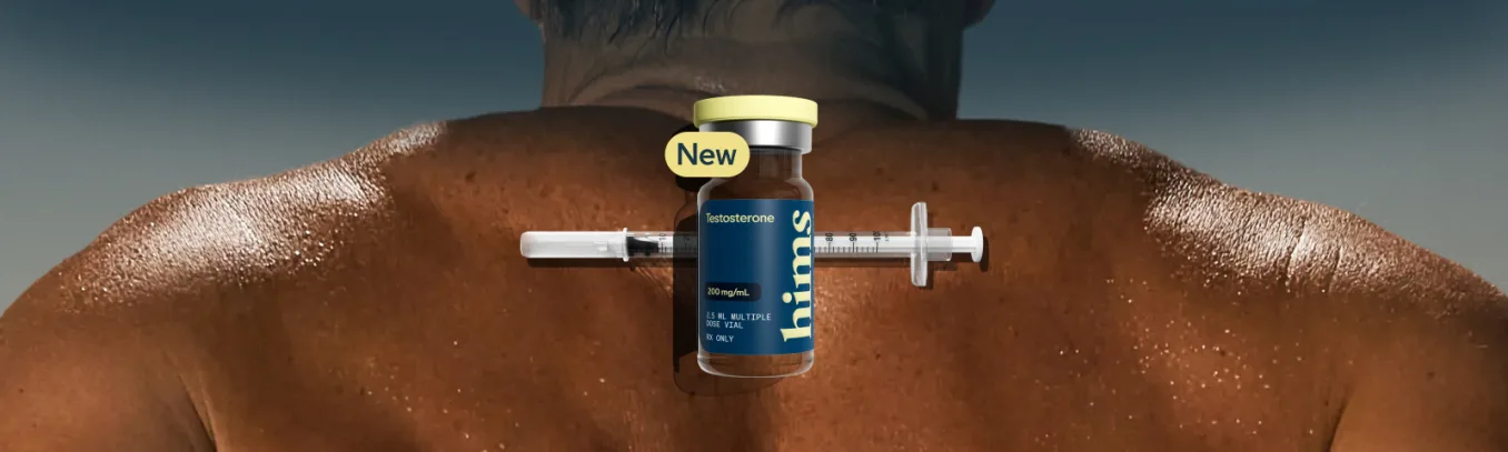 Testosterone injection vial and syringe resting on a man's back